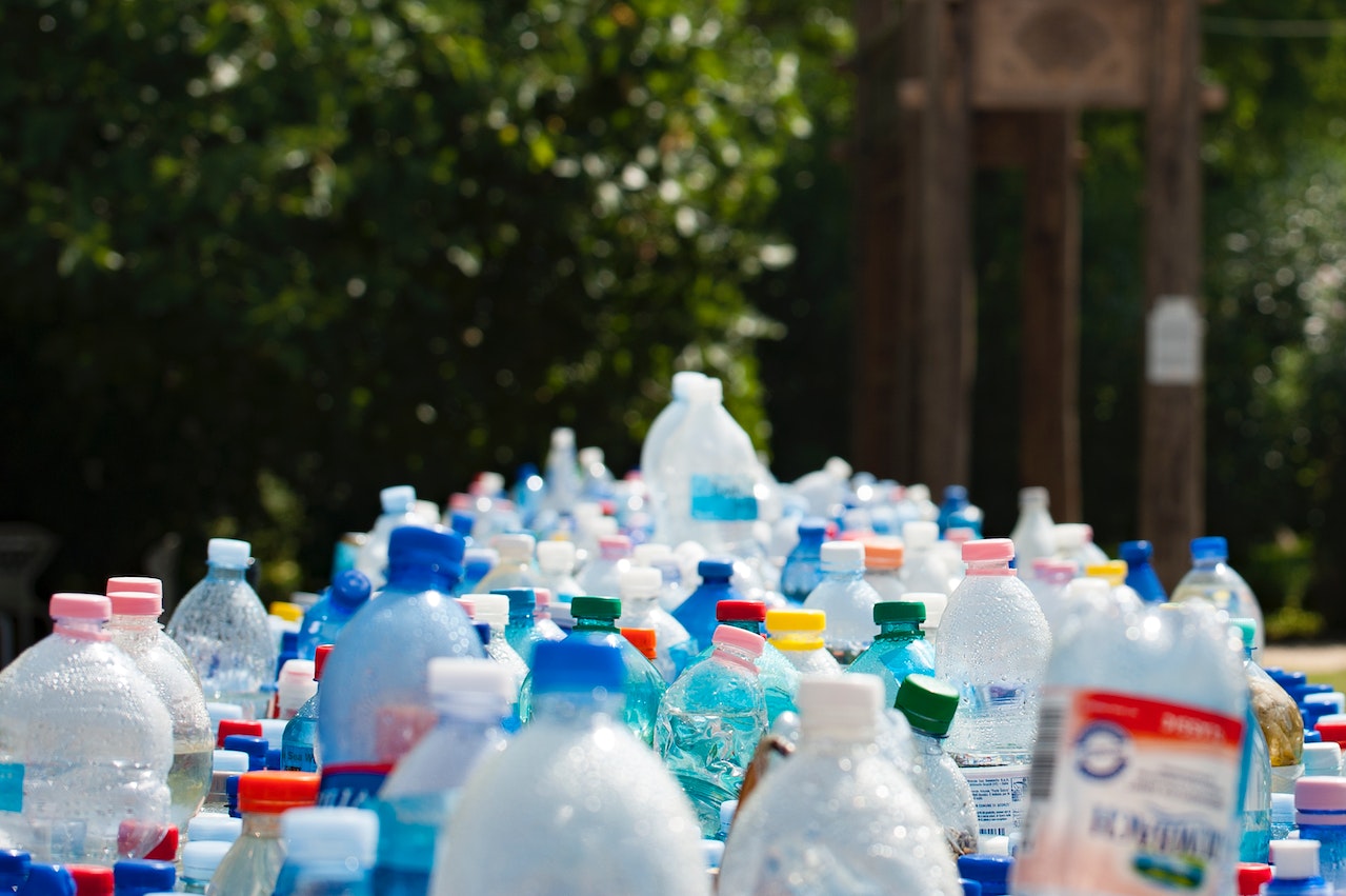 Workers sorting recyclable materials at recycling plant